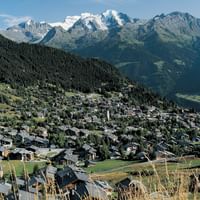 A Valais town in a beautiful valley between hills and mountains.