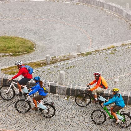 Group of cyclists on the Tremola ascent on the old Gotthard post road