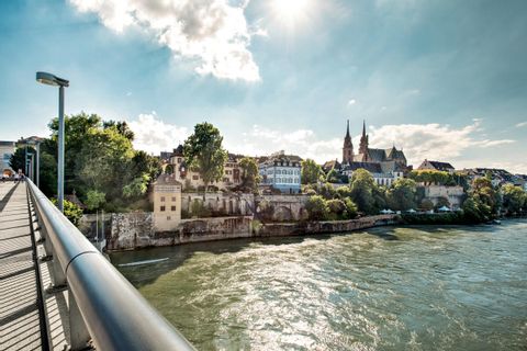 Photo from a bridge on the bank of the Rhine with church in the background