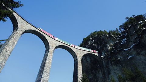The Rhaetian Railway runs over the Landwasser Viaduct in the Albula region in the canton of Graubünden.