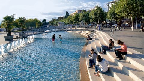 A pool with water feature in Lausanne.