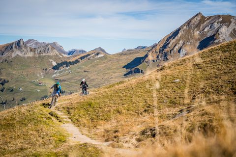 Two mountain bikers ride through remote mountain landscapes in Central Switzerland.